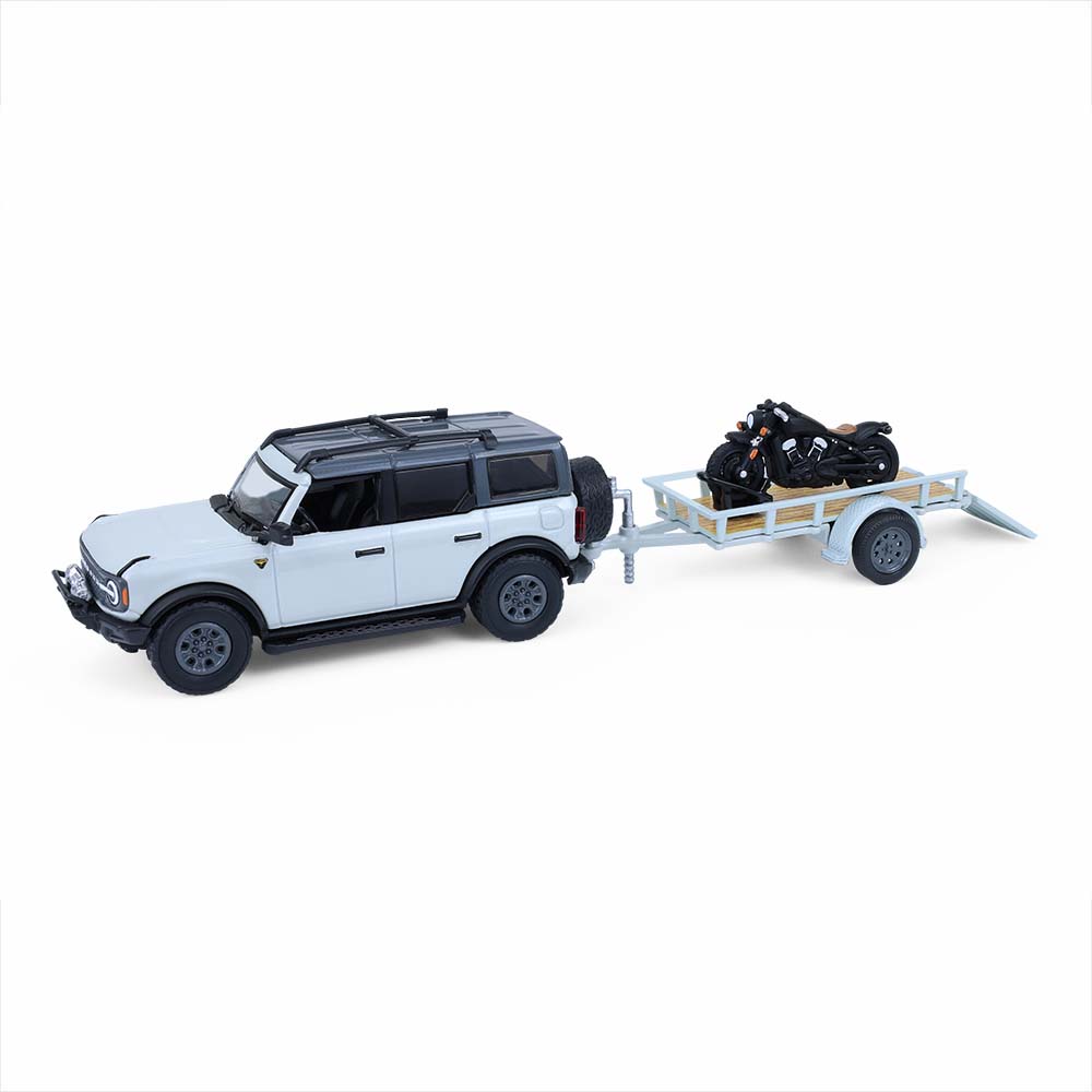 Bronco 4-Door Badlands in Cactus Grey with Utility Trailer and Motorcycle